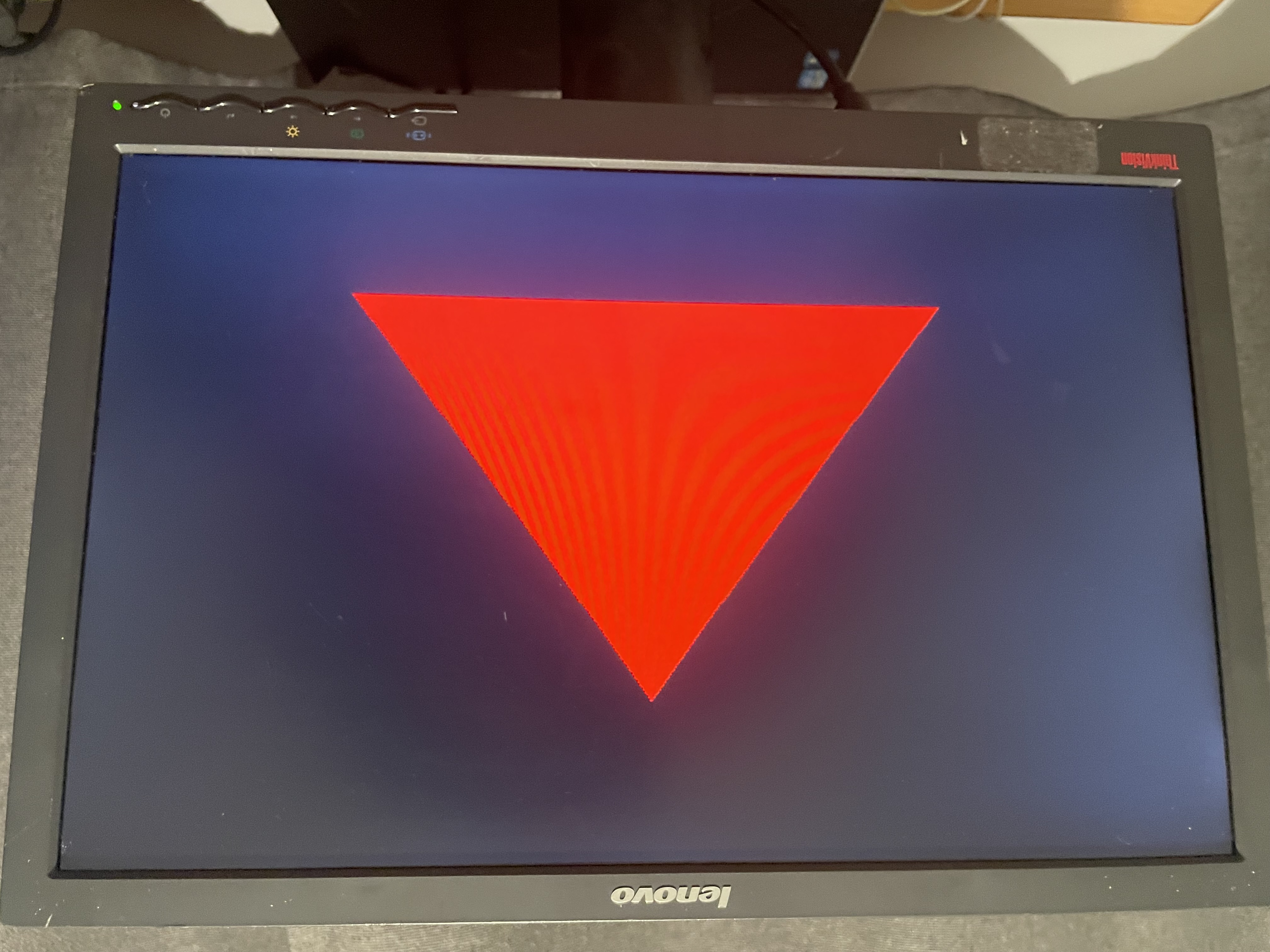 A red triangle on a monitor, rendered by the FPGA